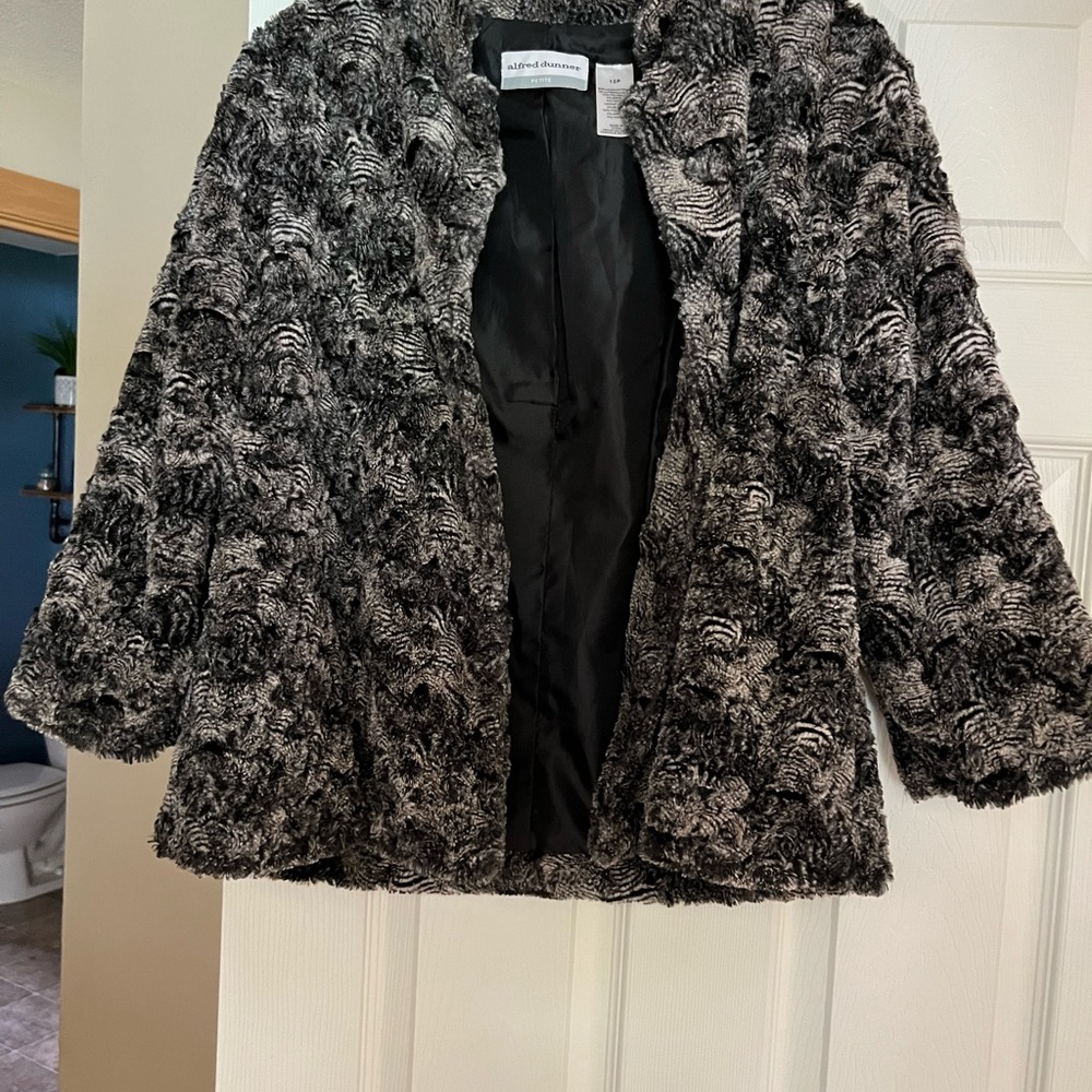 Black and gray swirl faux fur like jacket. Slightly cropped sleeve